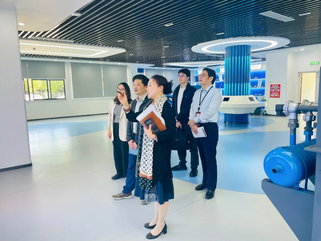 苏州市社保中心副主任朱敏峰一行莅临我司开展政协提案工作调研插图2